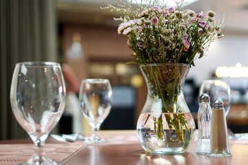 Flowers in a vase on a table, serving, bouquet