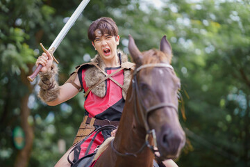 A fantasy ancient warrior riding a horse in the forest with a dramatic action scene.