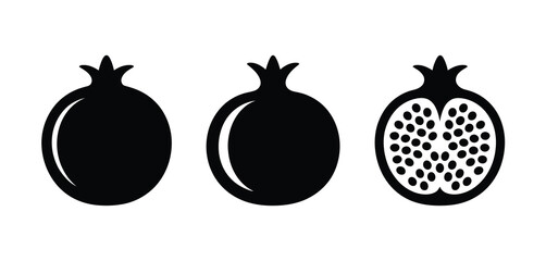 Three pomegranates one halved showing seeds black silhouette