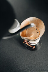 Aromatic Freshly Brewed Coffee in Elegant Pour Over Coffee Maker on Dark Background