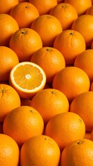Close-up of many oranges, one halved