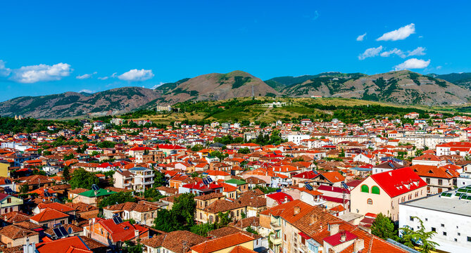 Panoramic View of Kor&ccedil;a, Albania with Red-Tiled Roofs and Mountain Backdrop