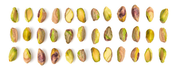 Fried salt pistachio nuts isolated. Baked pistachios pile, roasted green pistache fruits on white