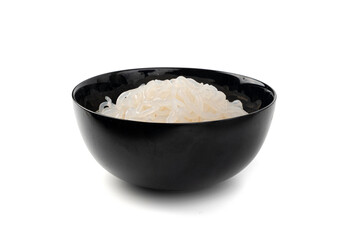 Shirataki or konnyaku pasta in black bowl isolated. Konjak jelly noodles, Japanese zero calorie...