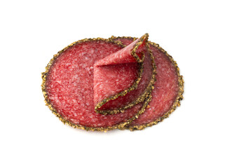 Obraz premium Pepper salami cuts isolated, thin sausage slices. Sliced dry chorizo, sausages round pieces