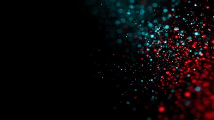 Abstract design with vibrant teal and red particles against a black background.