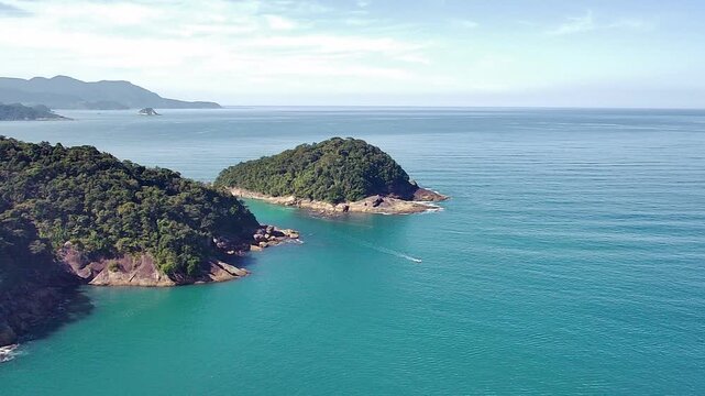 Aerial view of Cachada&ccedil;o Beach (Praia do Cachada&ccedil;o) in Trindade, Rio de Janeiro, showing Trindade Island and the natural pools, with turquoise waters and lush Atlantic Rainforest on a sunny day.
