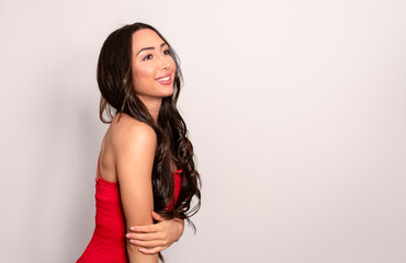 Fototapeta premium Beautiful young woman with long black shiny hair 