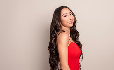 Fototapeta premium Beautiful young woman with long black shiny hair 