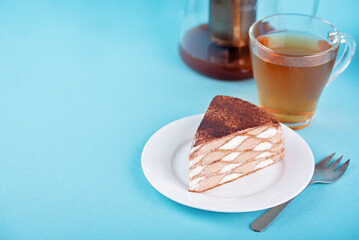 Chocolate vanilla crepe cake with whipped cream filling in the plate