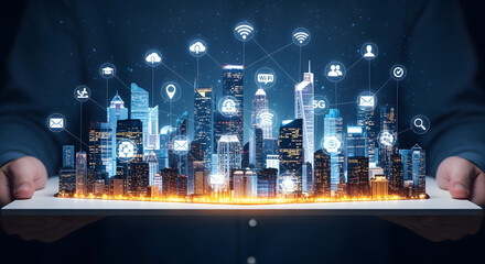 Man Holding Glowing Miniature City on Tablet Under Digital Icons in Navy and Orange on Dark Background