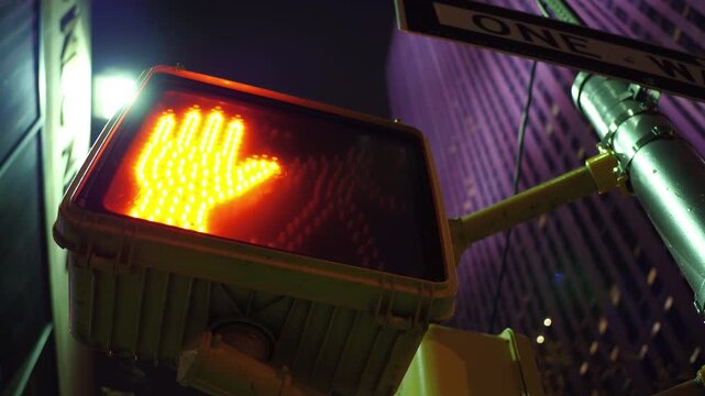 Pedestrian crossing light in big city evening hours 4k