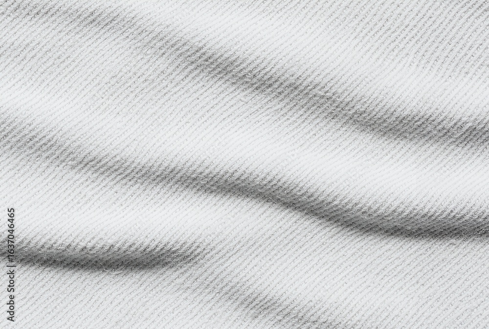 Poster close-up view of a textured white fabric with subtle diagonal lines and gentle waves.