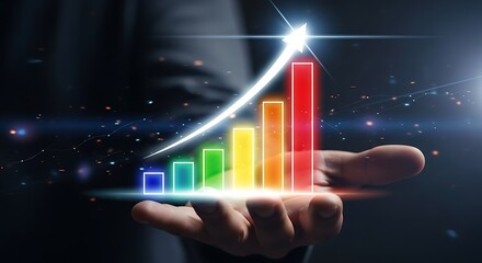 Hand holding a colorful chart with upward arrow representing business growth and financial success