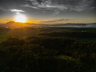 Aerial Sunset Over North Queensland Mountains and Farmland – Scenic Farmland Landscape, Misty Afternoon Light, Tropical Rural Beauty, Nature Photography, Australian Countryside, Farming Aerial View