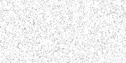Abstract grey scattered dot pattern background design with varying tones and white space creating texture and visual interest.
