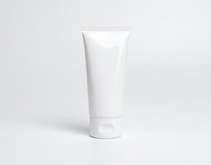Blank white plastic tube for cosmetic cream or lotion. Skincare product packaging mockup template on an isolated background.