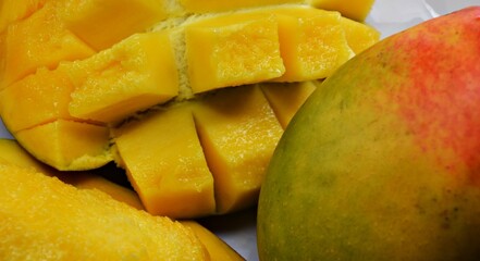 fresh mango fruit in a plate cut it slide