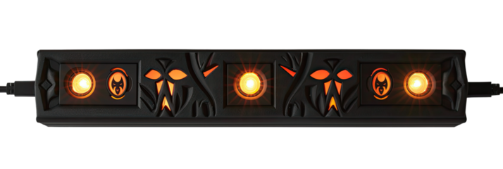 Black LED strip with repeating carved monster faces and glowing orange LEDs