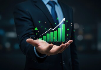 Businessman holding a growing financial chart in his hand