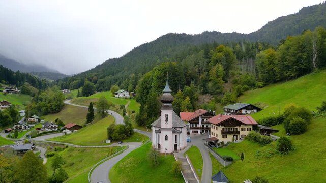 Aerial view of historic Wallfahrtskirche Maria Gern church under rain near Berchtesgaden city in Germany in autumn time.