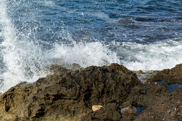 waves crashing on rocks