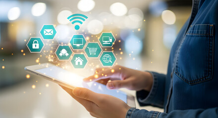 Person Using a Tablet Displaying Glowing Smart Technology Icons in a Blurred Light Background