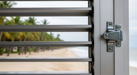 Louvered window's view palm trees, beach, ocean, slightly overcast sky
