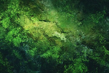 Textured, vibrant green and yellow rock face