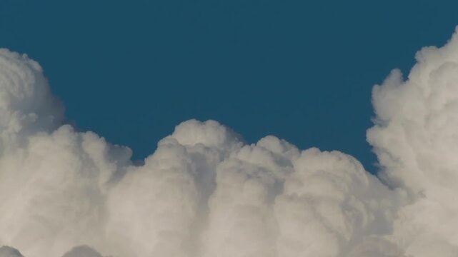 Tokyo, Japan - August 8, 2025: Quickly Moving cumulonimbus cloud or thunderhead on blue sky background in summer