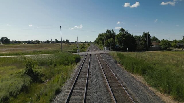 Railroad Tracks Stretching Across Rural Countryside