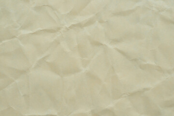 Crumpled Beige Paper Background Creating a Texture Ideal for Design Projects and Crafts