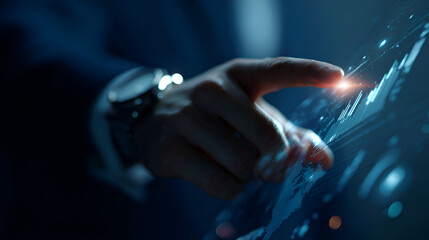 A close-up of a hand touching a glowing point on a futuristic digital data interface. The high-tech scene is perfect for themes of technology, data analysis, and innovation.
