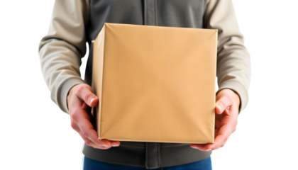 A man unboxes a brown delivery box labeled for Black Friday sales, showcasing excitement for shopping discounts