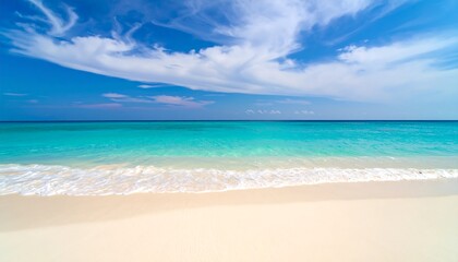 Obraz premium Stunning tropical beach with white sand, turquoise waters, and clear blue skies, perfect for travel and tourism designs.