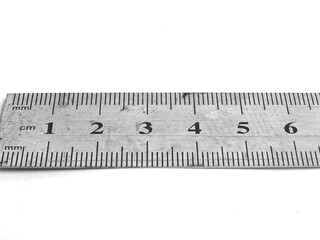 A metal ruler with very sharp measurement accuracy is photographed against a white background.