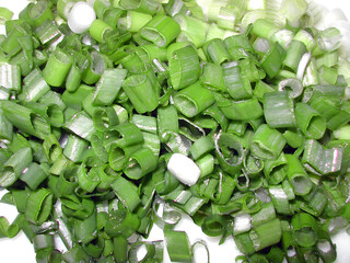 Close-up of finely chopped fresh scallions, organically grown in local farm. Ideal for healthy...