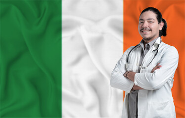 Ireland Health and Care concept. Male doctor on Ireland flag. Doctor with crossed arms on Ireland...