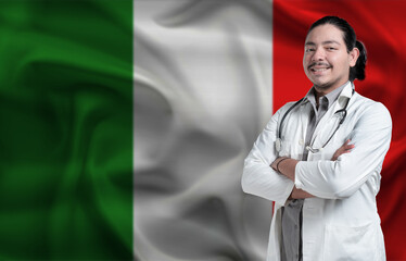 Italy Health and Care concept. Male doctor on Italy flag. Doctor with crossed arms on Italy flag