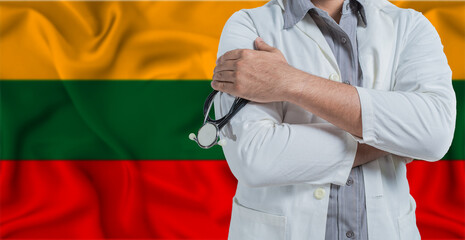 Doctor with stethoscope on arm with Lithuania flag behind. National health system of Lithuania,...