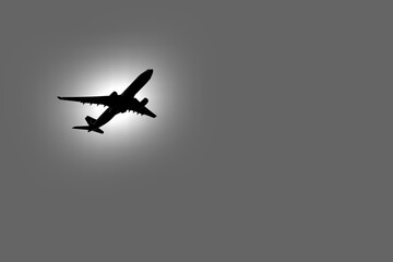 Airplane in flight surrounded by a luminous halo.