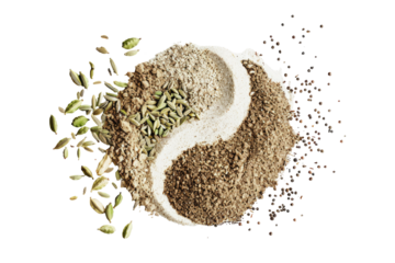 Spices arranged in yin-yang design.  Whole spices like fennel and cardamom surround a bowl of ground spices.  Dark peppercorns are scattered around the mix