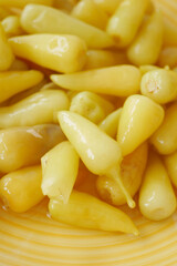 Yellow chili peppers in a vibrant bowl