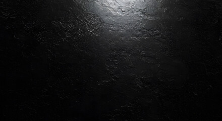 Dark textured surface with a spotlight