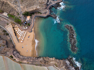 Tenerife coast, aerial view from a 90° angle of a sandy beach, the Atlantic Ocean and rocks
