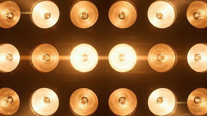 A wall of warm incandescent light bulbs flashing randomly This seamless looping animation is perfect for stage backgrounds concerts award shows and VJ performan