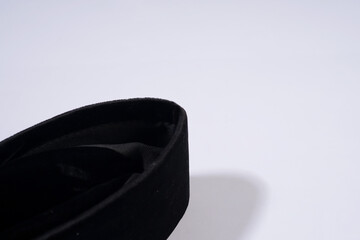 Close-up of a Black Peci Cap with a Velvet Texture