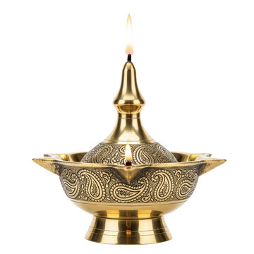 A beautiful traditional indian brass oil lamp, known as a diya or samai, featuring two lit wicks and elegant engraved paisley patterns. Perfect for religious ceremonies or cultural decor.