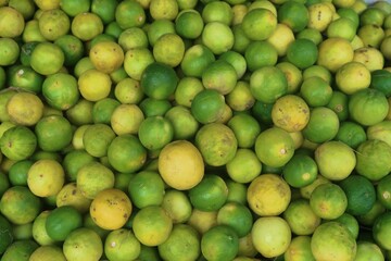 green and yellow lemon on the background