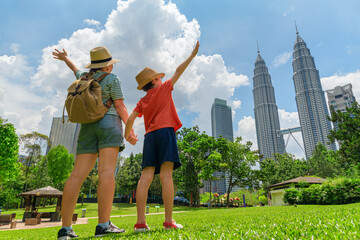 Female tourist and her son enjoying cityscape of Kuala Lumpur